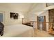 Inviting bedroom area with a unique loft railing and a cozy nook for a serene retreat at 2378 Hearth Dr # 6, Evergreen, CO 80439