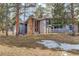 Charming multi-story home with a stone accent chimney nestled among mature trees at 2378 Hearth Dr # 6, Evergreen, CO 80439