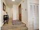 Hallway featuring beautiful front door, wood floors, and coat closet at 2378 Hearth Dr # 6, Evergreen, CO 80439