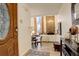 Bright entryway view of the dining and living room with stone fireplace and large windows at 2378 Hearth Dr # 6, Evergreen, CO 80439