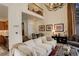 Bright living room with high ceilings, modern chandelier, and views to upper level at 2378 Hearth Dr # 6, Evergreen, CO 80439