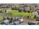 Residential neighborhood aerial view with green fields and well-spaced houses at 9371 Desert Willow Trl, Highlands Ranch, CO 80129