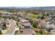 Residential neighborhood view with mature trees and houses spread over well-maintained plots at 9371 Desert Willow Trl, Highlands Ranch, CO 80129