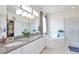 Bright bathroom with double vanity, soaking tub, and separate shower at 9371 Desert Willow Trl, Highlands Ranch, CO 80129