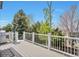Private deck offers a serene outdoor space with peaceful treetop views at 9371 Desert Willow Trl, Highlands Ranch, CO 80129