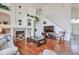 Stylish living room featuring a fireplace, a TV, and an open staircase at 9371 Desert Willow Trl, Highlands Ranch, CO 80129
