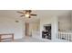 Open loft area with carpet flooring and built-in shelving at 9371 Desert Willow Trl, Highlands Ranch, CO 80129