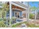 Back patio boasts comfortable outdoor seating, a hot tub, and lush landscaping at 9371 Desert Willow Trl, Highlands Ranch, CO 80129