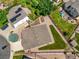 Beautiful yard of a home with a small shed, green grass, and a wooden fence, seen from above at 9620 Mallard Pond Way, Littleton, CO 80125