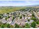 An aerial shot of a suburban neighborhood with many trees and beautiful landscaping at 9620 Mallard Pond Way, Littleton, CO 80125