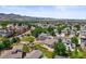 An aerial view of the neighborhood, trees, roofs, and large yards in the landscape at 9620 Mallard Pond Way, Littleton, CO 80125