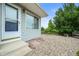 Home exterior showcasing gravel landscaping and wood fence along the backyard at 9620 Mallard Pond Way, Littleton, CO 80125