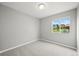 Bedroom with carpet flooring, natural light, and view to the backyard at 9620 Mallard Pond Way, Littleton, CO 80125