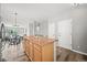 Kitchen island overlooks the dining and living areas with hardwood floors at 9620 Mallard Pond Way, Littleton, CO 80125