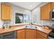 Kitchen sink with windows overlooking the neighborhood at 9620 Mallard Pond Way, Littleton, CO 80125