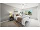 Comfortable bedroom with ceiling fan, carpet flooring and lots of natural light at 9620 Mallard Pond Way, Littleton, CO 80125