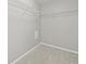 Empty walk-in closet with carpet floors and wire shelving at 9620 Mallard Pond Way, Littleton, CO 80125