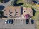 A beautiful aerial view of townhome Unit 78 showing reserved parking spots, manicured landscaping, and great location at 8260 Washington St # 78, Denver, CO 80229