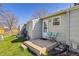 The backyard has a small deck and a grassy area that is perfect for outdoor activities at 8260 Washington St # 78, Denver, CO 80229
