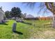 Large backyard space with a split rail fence and lush green grass, perfect for recreation at 8260 Washington St # 78, Denver, CO 80229