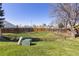 Large, fenced backyard with ample space for recreation and gardening in a serene neighborhood setting at 8260 Washington St # 78, Denver, CO 80229