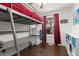 Bedroom with lofted bed frame and desk area under a window at 8260 Washington St # 78, Denver, CO 80229