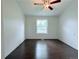 This bedroom features wood flooring and a bright window view at 8260 Washington St # 78, Denver, CO 80229