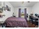 Bedroom with natural light, dark desk, and window overlooking yard at 8260 Washington St # 78, Denver, CO 80229