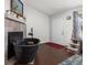 View of bedroom from fireplace and entrance, hardwood floors and white walls at 8260 Washington St # 78, Denver, CO 80229