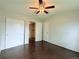 Comfortable bedroom has a ceiling fan, closet, and convenient access to laundry at 8260 Washington St # 78, Denver, CO 80229