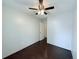 Bedroom featuring neutral walls, wood-look flooring and a fan to provide comfort and air circulation at 8260 Washington St # 78, Denver, CO 80229