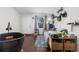 Bedroom with natural light, laminate wood flooring, and door to hallway at 8260 Washington St # 78, Denver, CO 80229