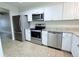 Eat-in kitchen showcases stainless steel appliances and ample countertop space at 8260 Washington St # 78, Denver, CO 80229