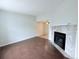 Inviting living room with hardwood floors and a cozy tile fireplace at 8260 Washington St # 78, Denver, CO 80229