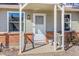 Charming front porch with brick accents and welcome mat at unit 78 at 8260 Washington St # 78, Denver, CO 80229