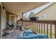 Cozy balcony featuring comfortable seating and a view of the surrounding neighborhood at 3414 S Eagle St # 201, Aurora, CO 80014