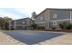 Exterior view of complex buildings near a covered swimming pool for community residents at 3414 S Eagle St # 201, Aurora, CO 80014