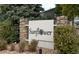 Sunflower community sign with stone pillars and well-maintained landscaping at 3414 S Eagle St # 201, Aurora, CO 80014