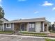 Attractive building exterior with stone accents, gray siding, and well-maintained landscaping at 3414 S Eagle St # 201, Aurora, CO 80014