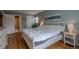 Spacious main bedroom with hardwood floors and a large, sunny window at 3414 S Eagle St # 201, Aurora, CO 80014