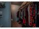 Organized walk-in closet with ample hanging space and shelving for storage at 3414 S Eagle St # 201, Aurora, CO 80014