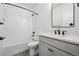 Bathroom features black fixtures and a shower-over-tub combination and gray tile flooring at 924 Sunflower St, Louisville, CO 80027