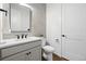 Stylish half-bathroom featuring modern vanity, sleek mirror, and contemporary fixtures at 924 Sunflower St, Louisville, CO 80027
