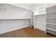 Walk-in closet featuring hardwood floors and ample shelf and rod space for storage at 924 Sunflower St, Louisville, CO 80027