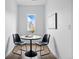 Cozy dining area with black chairs, and a round table perfect for intimate gatherings at 924 Sunflower St, Louisville, CO 80027