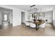 Contemporary dining area open to kitchen with modern lighting, hardwood flooring, and stylish decor at 924 Sunflower St, Louisville, CO 80027