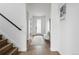 Inviting entryway with hardwood floors, staircase, and a bench, creating a warm welcome at 924 Sunflower St, Louisville, CO 80027