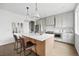 Stylish kitchen island featuring quartz countertops, stainless steel appliances, and pendant lighting at 924 Sunflower St, Louisville, CO 80027