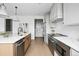 Modern kitchen featuring stainless steel appliances, white cabinets, and a large island at 924 Sunflower St, Louisville, CO 80027