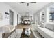 Open-concept living space with dining area and kitchen featuring hardwood floors and natural light at 924 Sunflower St, Louisville, CO 80027